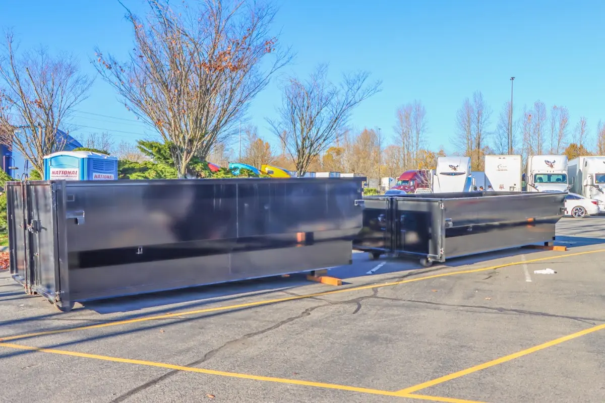 Professional dumpster rental service with roll-off container on residential driveway in Hickory Hills